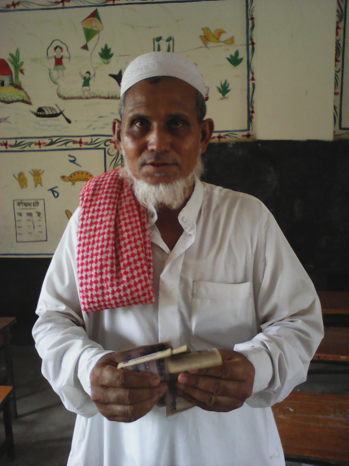 man holding money in bangladesh