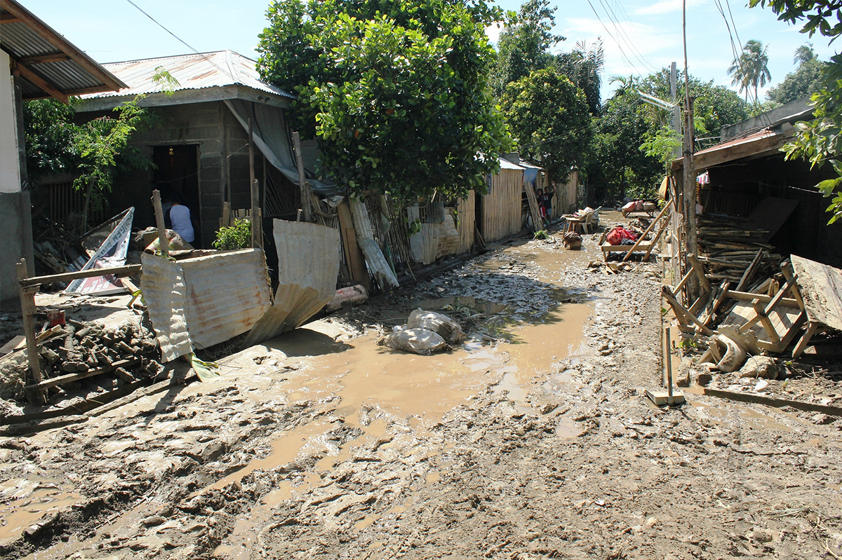 Destroyed houses and flooded street in uganda