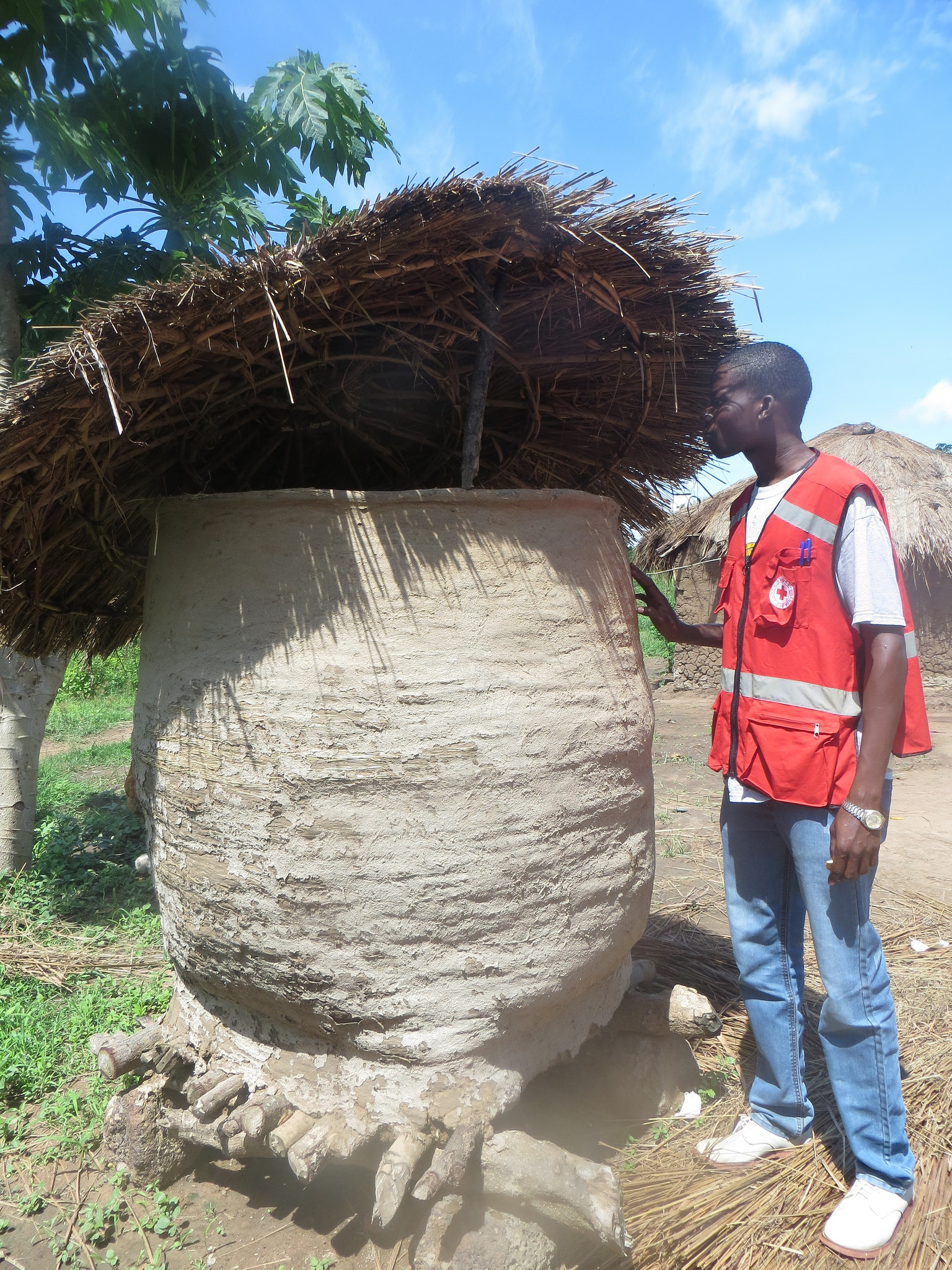 DRK helper views local village