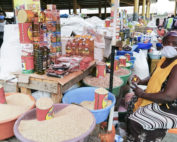 Sellers wearing protective face masks stand at their stall at the Asa Branca Market.