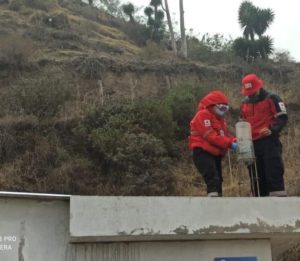 Ecuador Red Cross volunteers monitoring the ashfall with ashfall meters